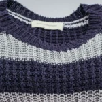 Striped knit sweater in cool tones for capsule wardrobe
