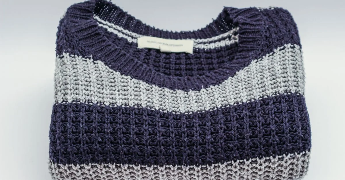 Striped knit sweater in cool tones for capsule wardrobe