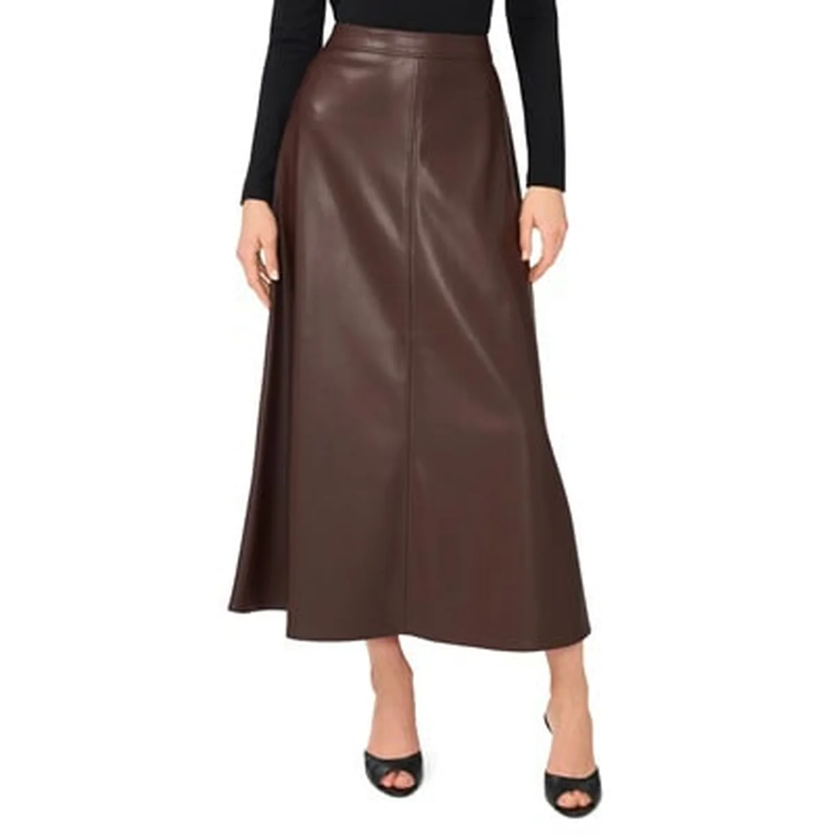 Woman in a brown faux leather A-line maxi skirt with a black top