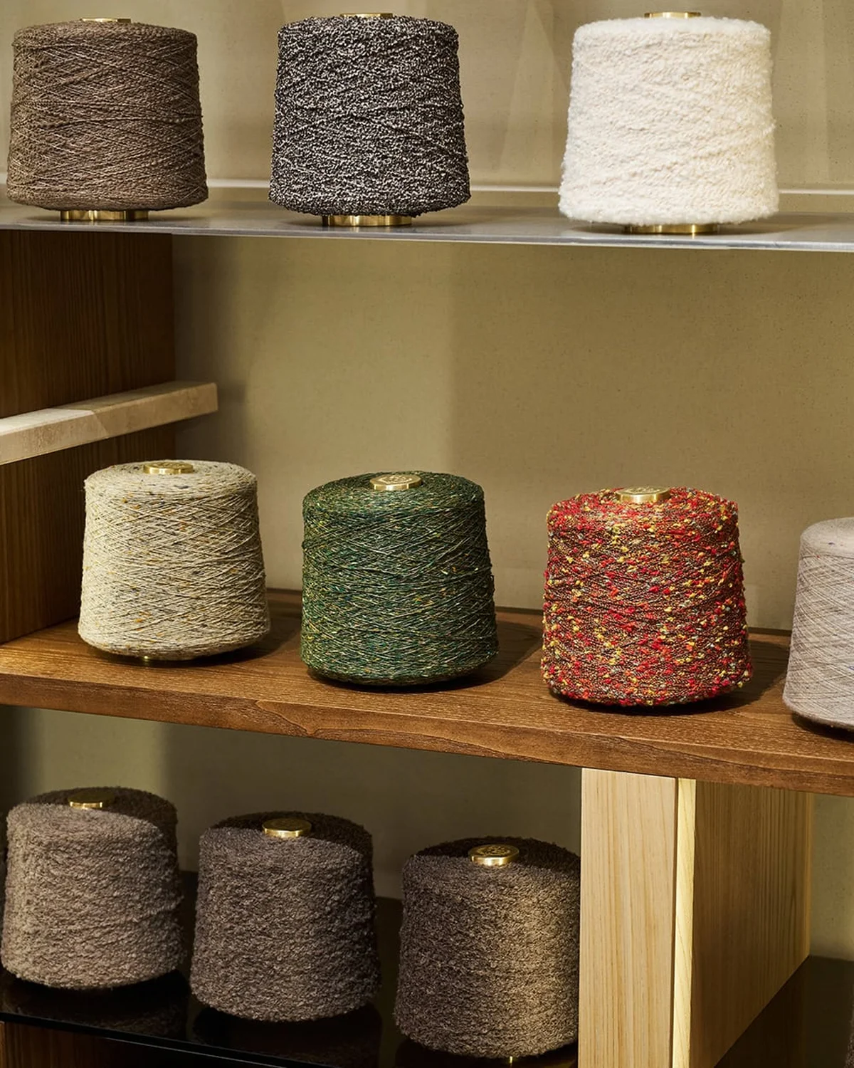 Shelves of yarn spools in a knitwear mill