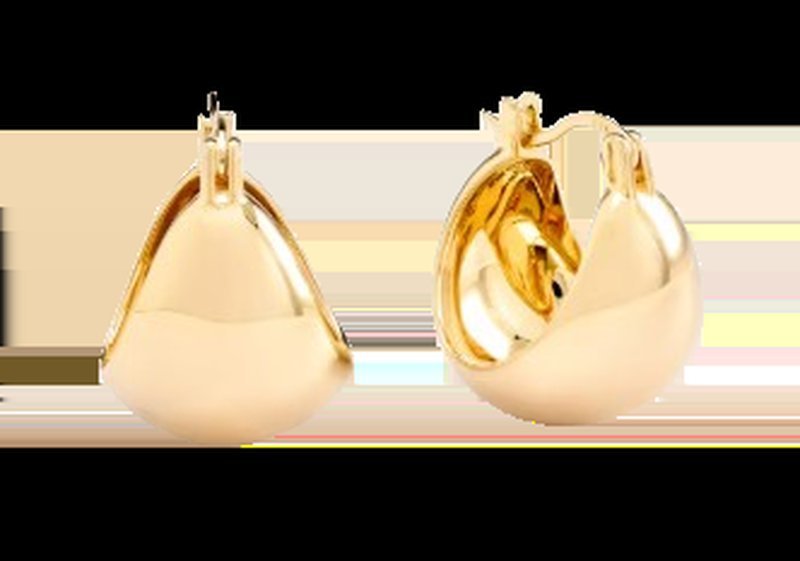 Gold boho hoop earrings on a striped background